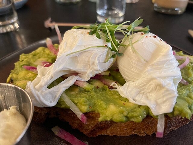 Cafe Fig signature dishes Cafe Fig Avocado Toast, Fried Chicken and Waffles, Tosh's Grilled Cheese.
